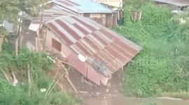 Landslide drags house into river during continuous rain in Thailand