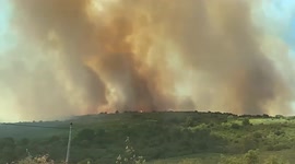 Plumes of smoke rise from wildfire burning in central France's Herault