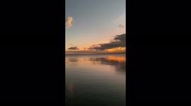 It's a calming lake with the beautiful sunset.