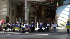 Ukrainians and supporters protest at Atlassian office in Sydney as they continue to do business in Russia