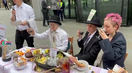 Extinction Rebellion activists host 'cannibal feast' outside Vanguard HQ in London