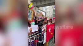 Burmese protesters wave flags in protest against military's executions