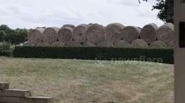 Millionaire estate owner builds wall of hay bales so he doesn't have to look at his neighbours
