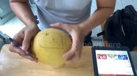 Man sculpts a beautiful heart on cantaloupe