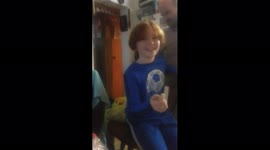 Boy Eats Dog Biscuit