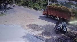 Watch - Two women narrowly escape after truck collides with two-wheeler - shocking CCTV footage