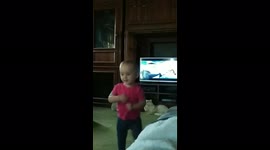 Toddler walks through living room