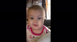 Baby Girl Bites Camera