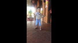 Four-year-old boy performing professional nunchaku
