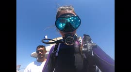 Scuba diving jumping in from boat