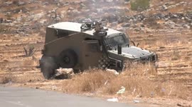 Palestinian demonstrators clash with Israeli forces following a protest against settlement expansion, in the village of al-Mughayer