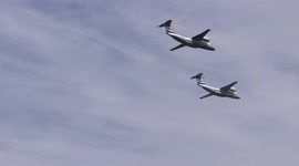 Military aircraft fly over river for Navy Day in St Petersburg, Russia