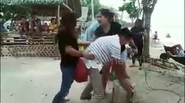 Partygoers play funny pop-the-balloon game