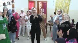 A Palestinian high school female student, Nagham Al-Najjar ,99.1%, celebrates with her family after heard the results of her final exams known as ''Tawjihi''