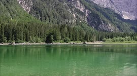 Beautiful lake Laghi di Fusine in Italy with mountains and forest