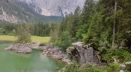 Beautiful lake Laghi di Fusine in Italy with mountains and forest
