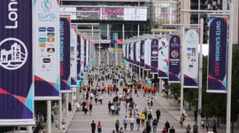 Staff outside Wembley Stadium celebrate as England win against Germany