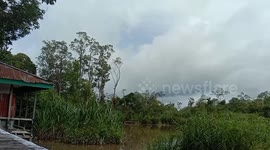 Bizarre moment whole island FLOATS on lake in Indonesia