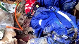 Firefighters rescue trapped people after mudslide hits southwestern China