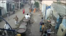 Dramatic footage shows man falling into vat of boiling porridge in Madurai, India, as locals struggle to pull him out
