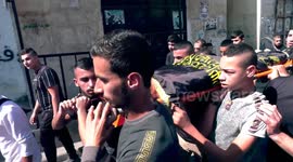 Palestinians carry the body of Dhurar al-Kafrini, killed by Israeli forces during a raid, at his funeral