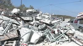 Palestinians inspect rubble that was their home, demolished by Israeli troops in the West Bank