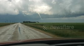 Motorist records as tornado touches down near town in Canada's Manitoba