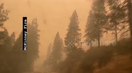 Motorist drives through California countryside blanketed by smoke from McKinney Fire