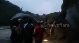 Resident buried under landlslide rocks rescued in the Philippines