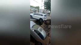 Car gets swallowed by sinkhole on road in eastern China