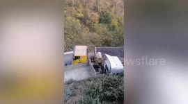 Lorries cause traffic chaos as they meet on narrow winding road in Myanmar