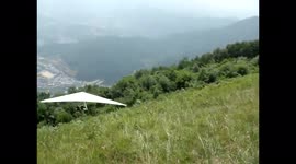 Hang glider take-off fail - flies straight into the trees