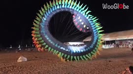 Thailand's kite festival features giant kite in flight