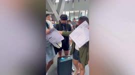 Friends print giant life-sized boarding passes for first trip together in the Philippines