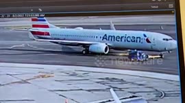 Plane being towed at LaGuardia airport crushes tractor as driver miraculously survives