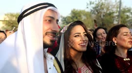 A Palestinian bride is dressed in a traditional outfit on her wedding day during the Palestinian Heritage Week