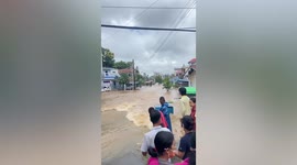 Heavy rain flash floods turn street into raging river in Myanmar