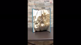 'Artist mesmerizingly folds HUNDREDS of BOOK PAGES to create the word ‘LET’S GO’
'