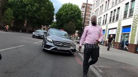 Foul-mouthed cyclist rages at driver after colliding in central London when vehicle suddenly pulled in