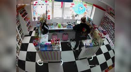 Sweet shop owners have released “freaky” footage of a suspected ghost triggering their security cameras