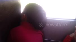 Boy Sleeps on School Bus
