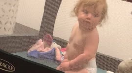 Baby Loses Balance in Crib