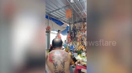 Black magic tattoo artist sparks outrage with coyote dancers next to Buddhist shrine