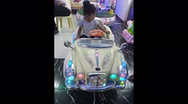 Yeah afcors she is very happy sit in the car and this music such a mood on this video is Bacha party and baby is very happy