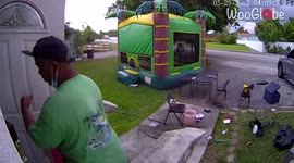 Bounce house, with kids in it, rolls over due to strong winds