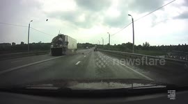 Trailer detaches from car and slams into oncoming truck in Russia