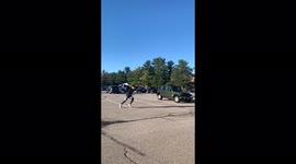 Guy jumps over car