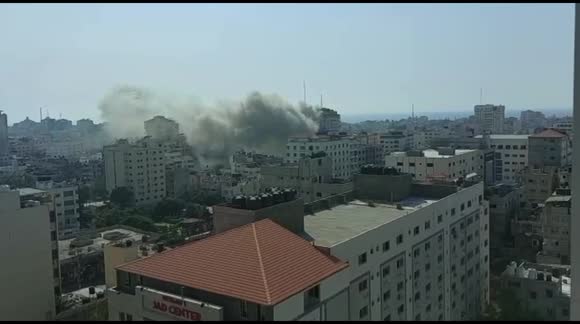 Smoke rises from high-rise Palestine Tower in Gaza City