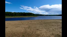 Timelapse of Swinsty Reservoir, part of Yorkshire Water, with areas of dry ground following heatwave in North Yorkshire, UK.