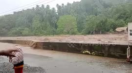 Tourists flee resort as raging river bursts its banks in the Philippines